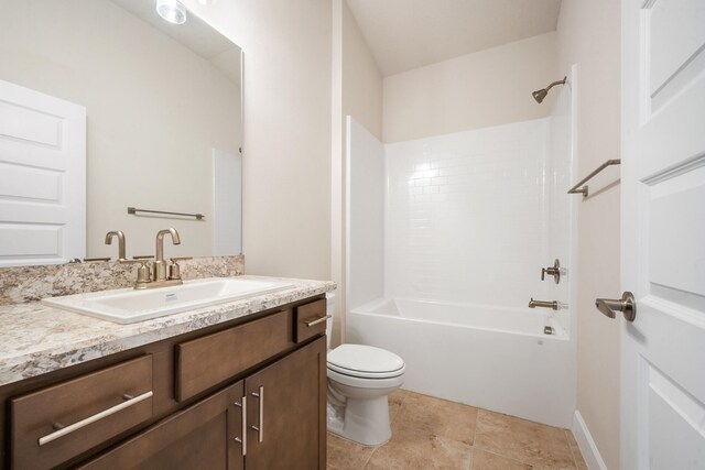 full bathroom with tile patterned floors, vanity, toilet, and washtub / shower combination