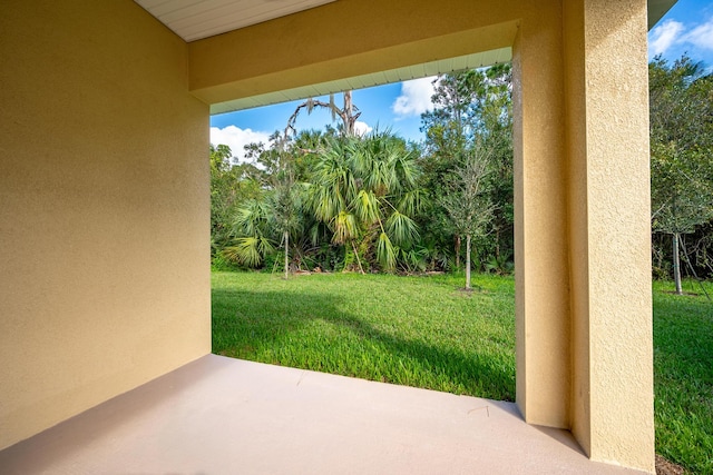 5215 San Benedetto Pl, Fort Pierce, FL 34951 - view of green lawn featuring a patio area