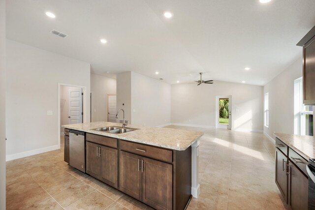 kitchen featuring a kitchen island with sink, sink, vaulted ceiling, stainless steel dishwasher, and ceiling fan