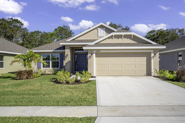 view of front facade with a garage and a front lawn