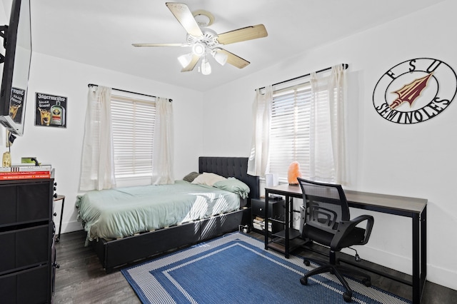 bedroom with dark wood-type flooring and ceiling fan