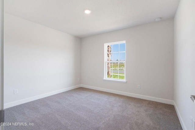 empty room featuring carpet flooring