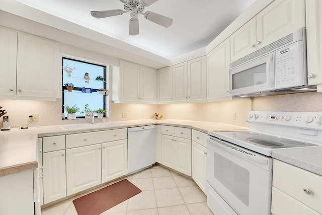 kitchen with white cabinetry, sink, ceiling fan, white appliances, and light tile patterned flooring