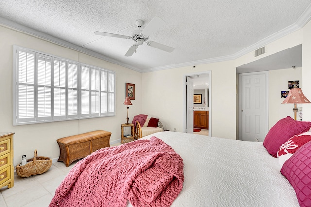 tiled bedroom featuring ceiling fan, ornamental molding, a textured ceiling, and connected bathroom