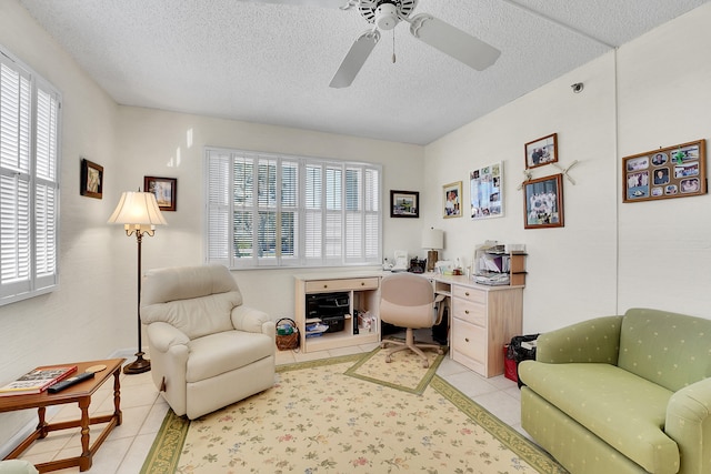 home office with light tile patterned floors, a textured ceiling, and a wealth of natural light