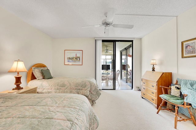 bedroom featuring ceiling fan, access to exterior, light colored carpet, and a textured ceiling