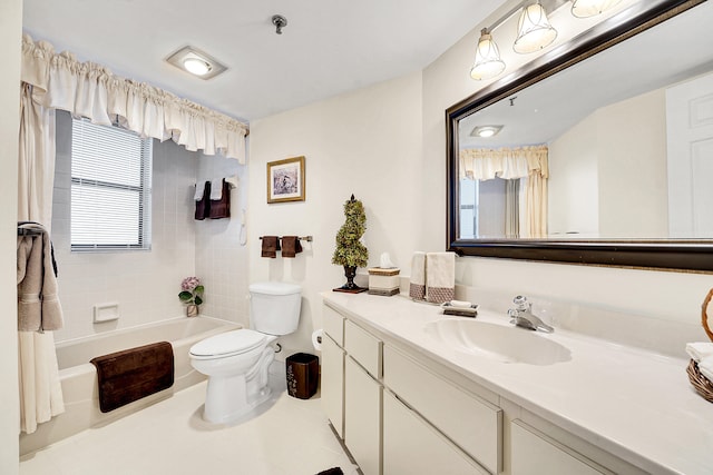 bathroom with tile patterned flooring, vanity, and toilet