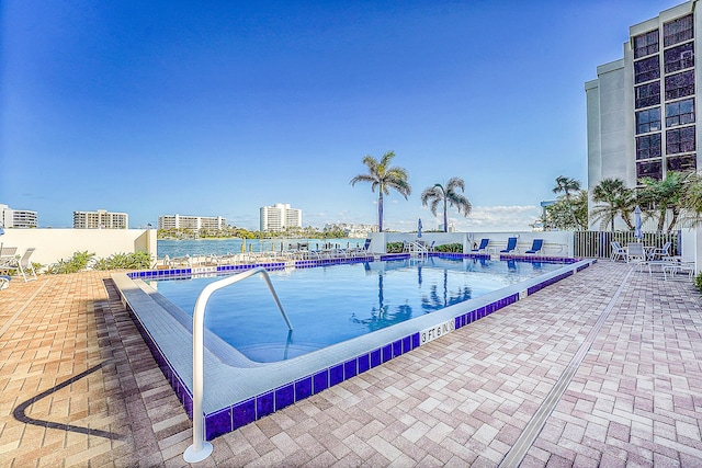 view of swimming pool featuring a patio