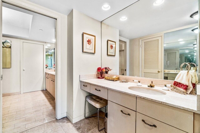 bathroom featuring vanity and wood-type flooring