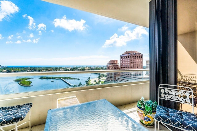 balcony with a city view and a water view