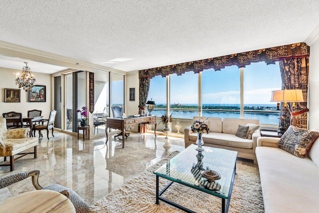 living area with plenty of natural light, marble finish floor, an inviting chandelier, and a water view