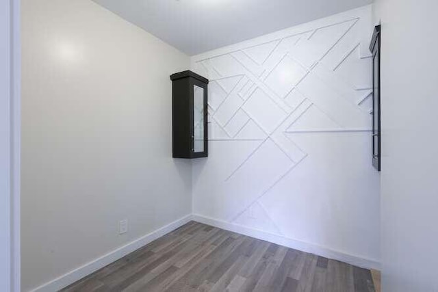 spare room featuring dark hardwood / wood-style flooring