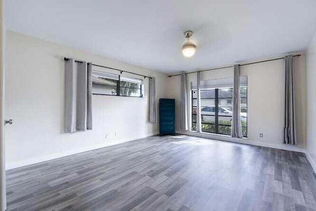 unfurnished room featuring hardwood / wood-style floors