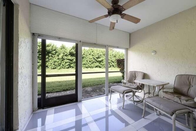 sunroom / solarium with ceiling fan