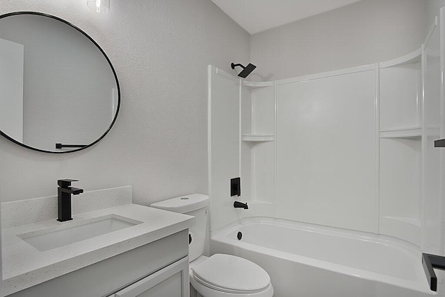 bathroom with a textured wall, shower / tub combination, vanity, and toilet