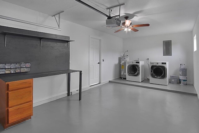 garage with electric panel, baseboards, washer and clothes dryer, a garage door opener, and electric water heater