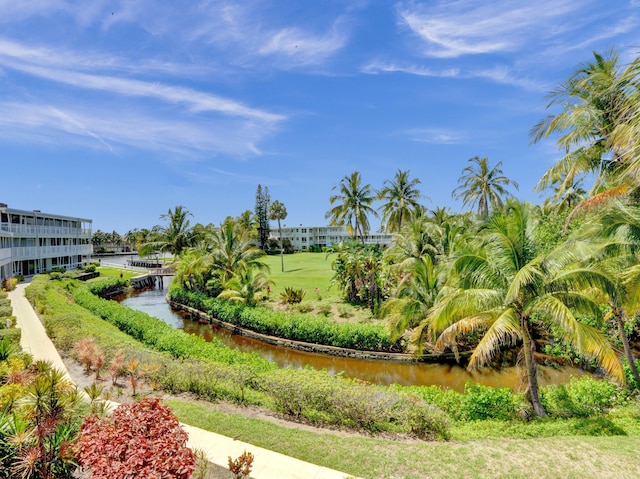 surrounding community featuring a water view