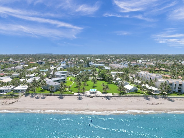 bird's eye view featuring a water view and a beach view