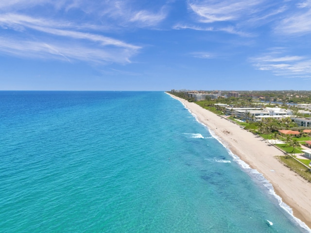 birds eye view of property featuring a water view and a view of the beach