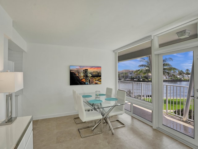 dining area featuring a water view