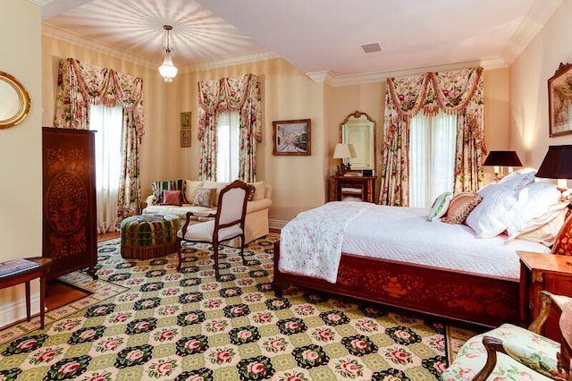 bedroom with crown molding and multiple windows