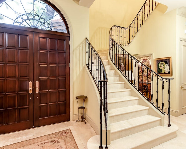 foyer with tile patterned flooring