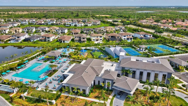 birds eye view of property with a water view