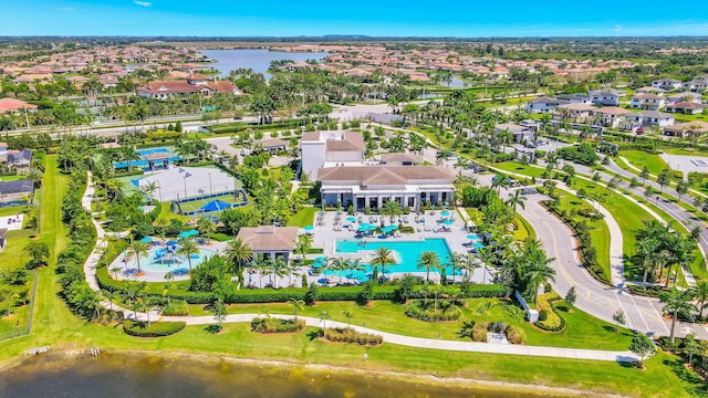 birds eye view of property with a water view