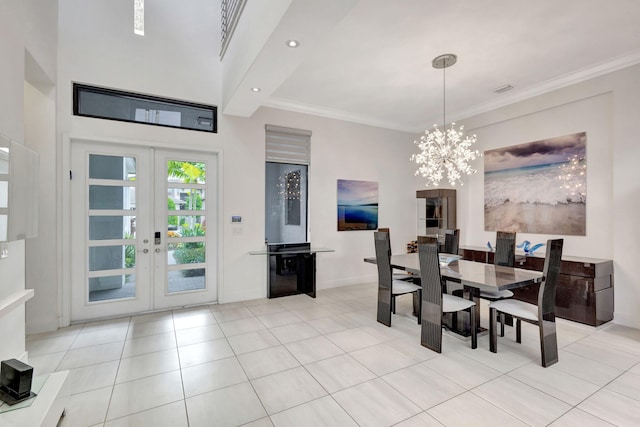 tiled dining area with an inviting chandelier, ornamental molding, and french doors