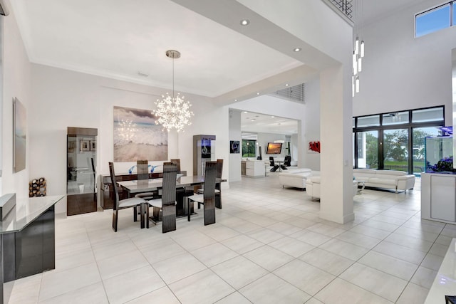 tiled dining space with a towering ceiling and a chandelier