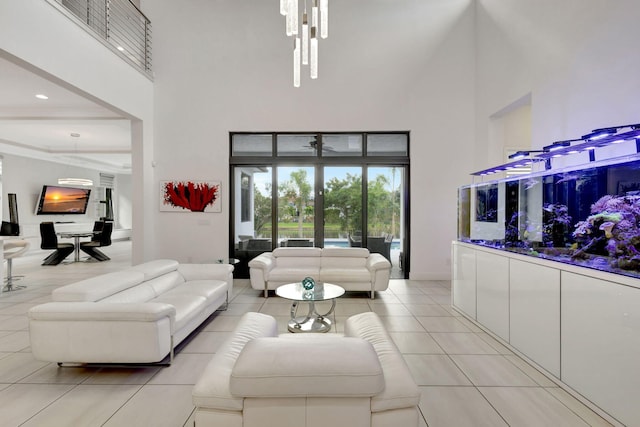 tiled living room with a towering ceiling and an inviting chandelier