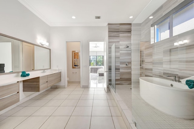 full bathroom featuring tile patterned floors, plenty of natural light, vanity, and independent shower and bath