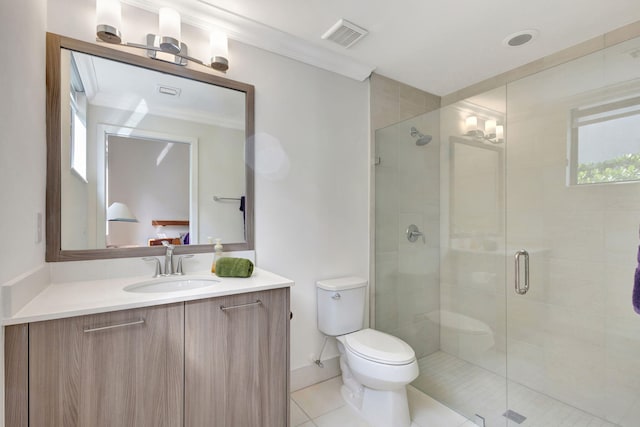 bathroom with tile patterned floors, crown molding, toilet, vanity, and a shower with shower door