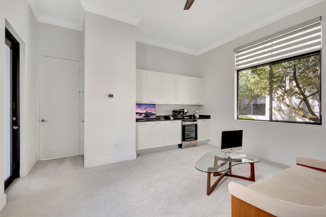 interior space featuring wine cooler and crown molding