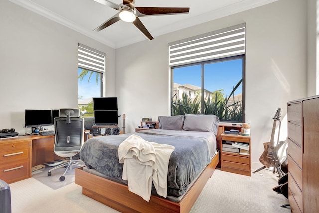 bedroom with multiple windows, ceiling fan, light colored carpet, and ornamental molding