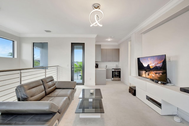 carpeted living room featuring ornamental molding and an inviting chandelier