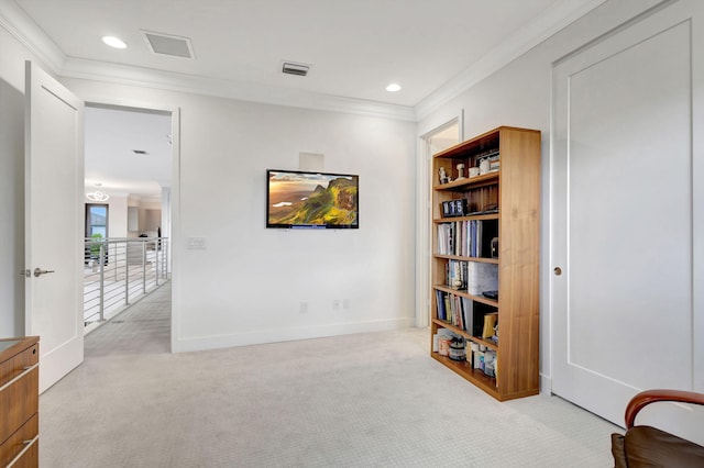 living area with crown molding and light colored carpet