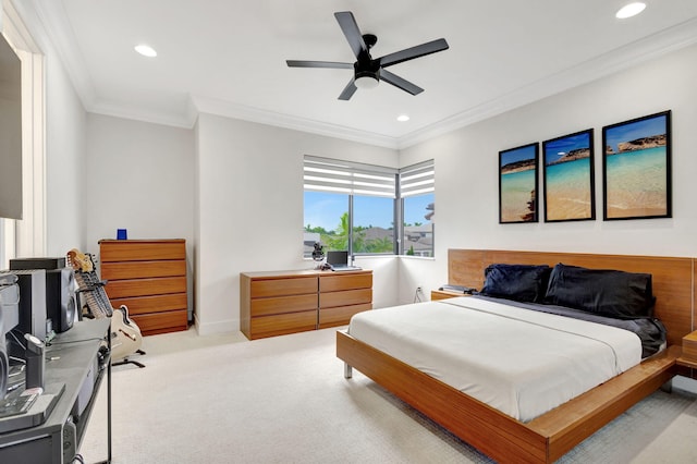 carpeted bedroom featuring ceiling fan and ornamental molding