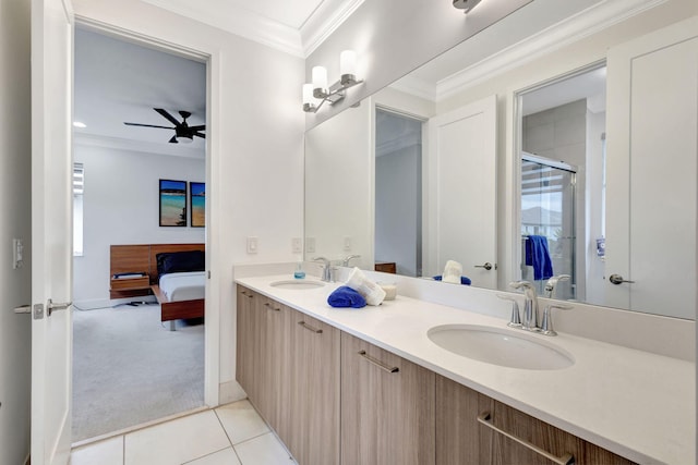 bathroom featuring tile patterned floors, walk in shower, vanity, ceiling fan, and crown molding