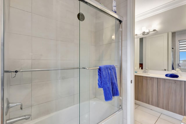 bathroom featuring shower / bath combination with glass door, vanity, ornamental molding, and tile patterned flooring