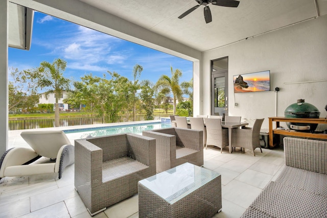 view of patio / terrace featuring a fenced in pool, grilling area, an outdoor living space, and a water view