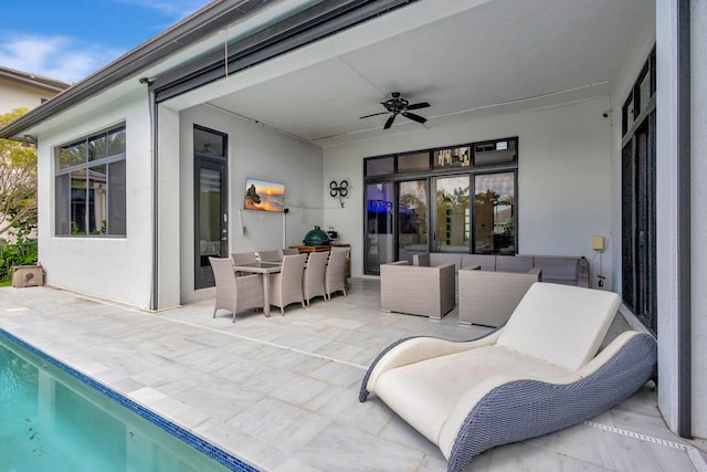 view of patio with outdoor lounge area and ceiling fan