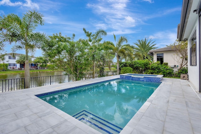 view of swimming pool featuring an in ground hot tub, a water view, and a patio area