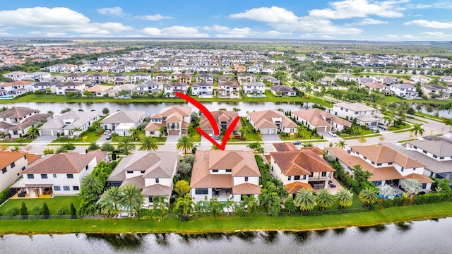 birds eye view of property featuring a water view