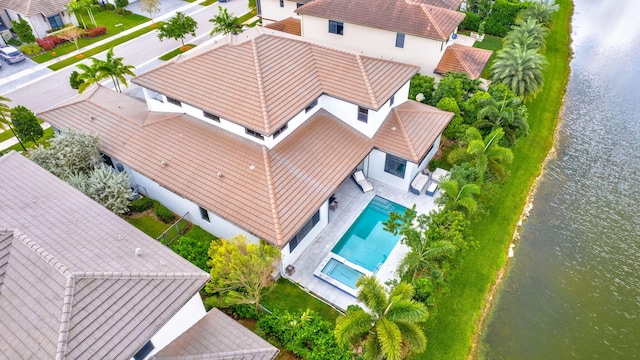 birds eye view of property featuring a water view