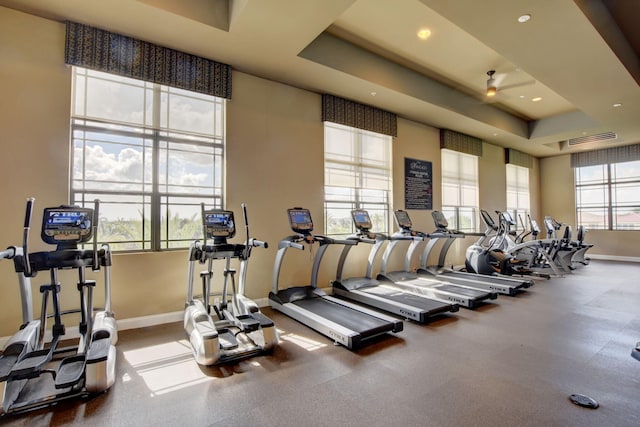 exercise room featuring a tray ceiling