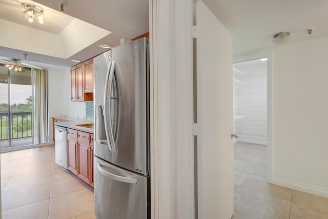 kitchen featuring appliances with stainless steel finishes, ceiling fan, and light tile patterned floors