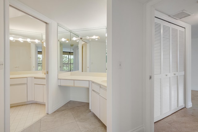 bathroom with vanity and tile patterned flooring