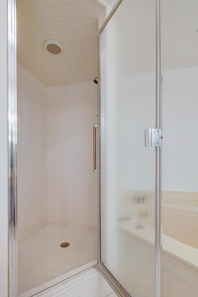 bathroom featuring an enclosed shower