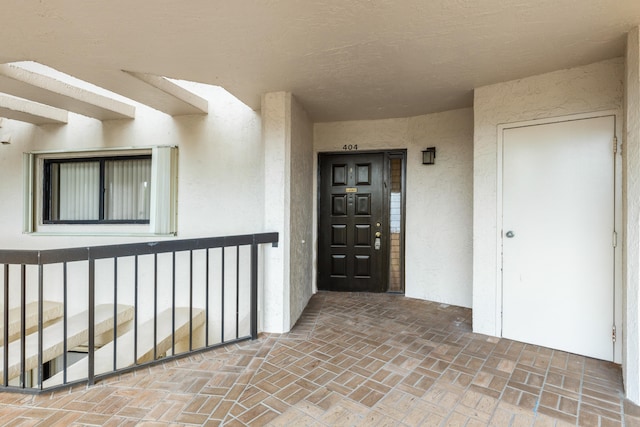 doorway to property with a porch